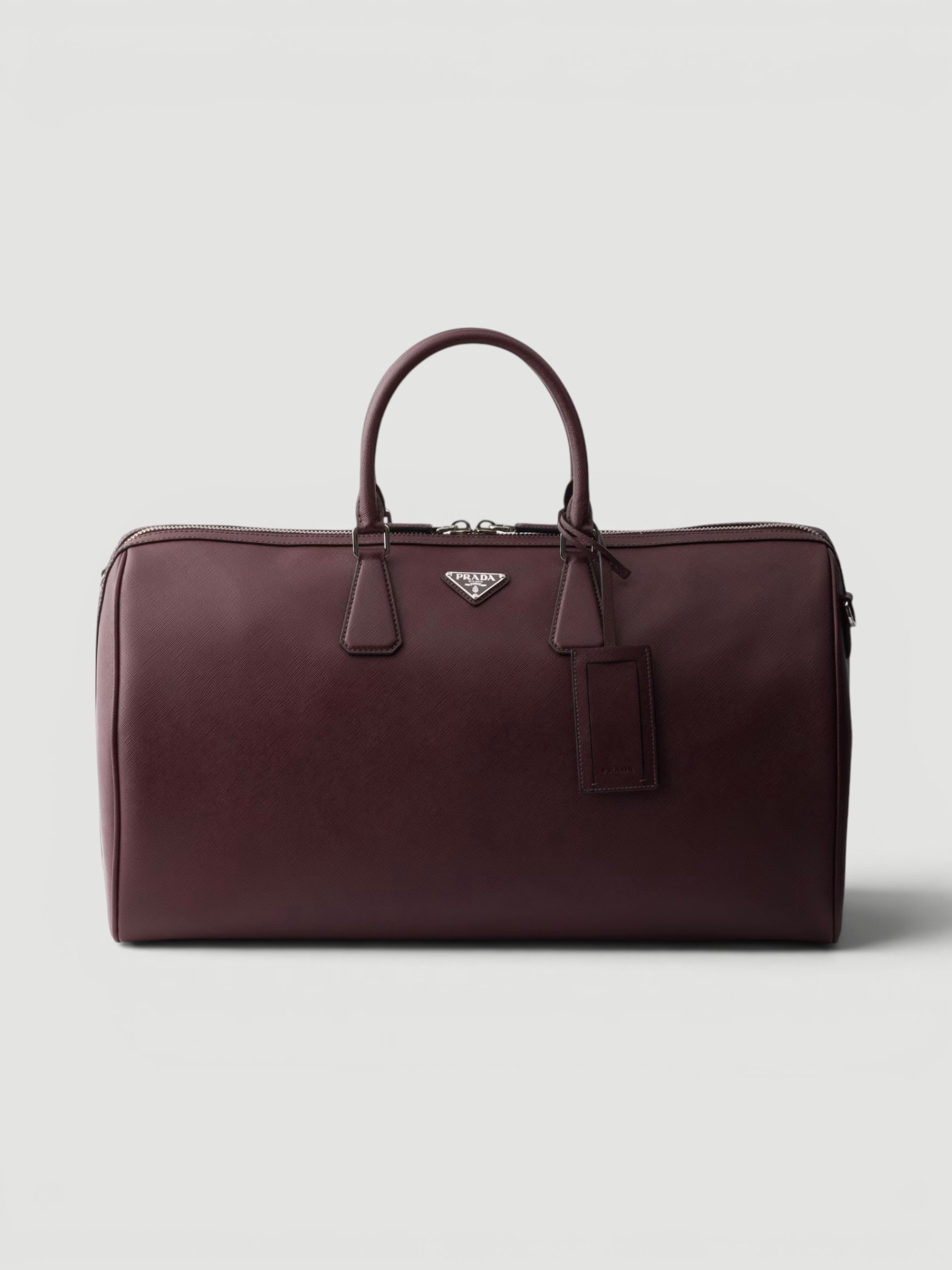 Prada Saffiano Leather Travel Bag in oxblood.