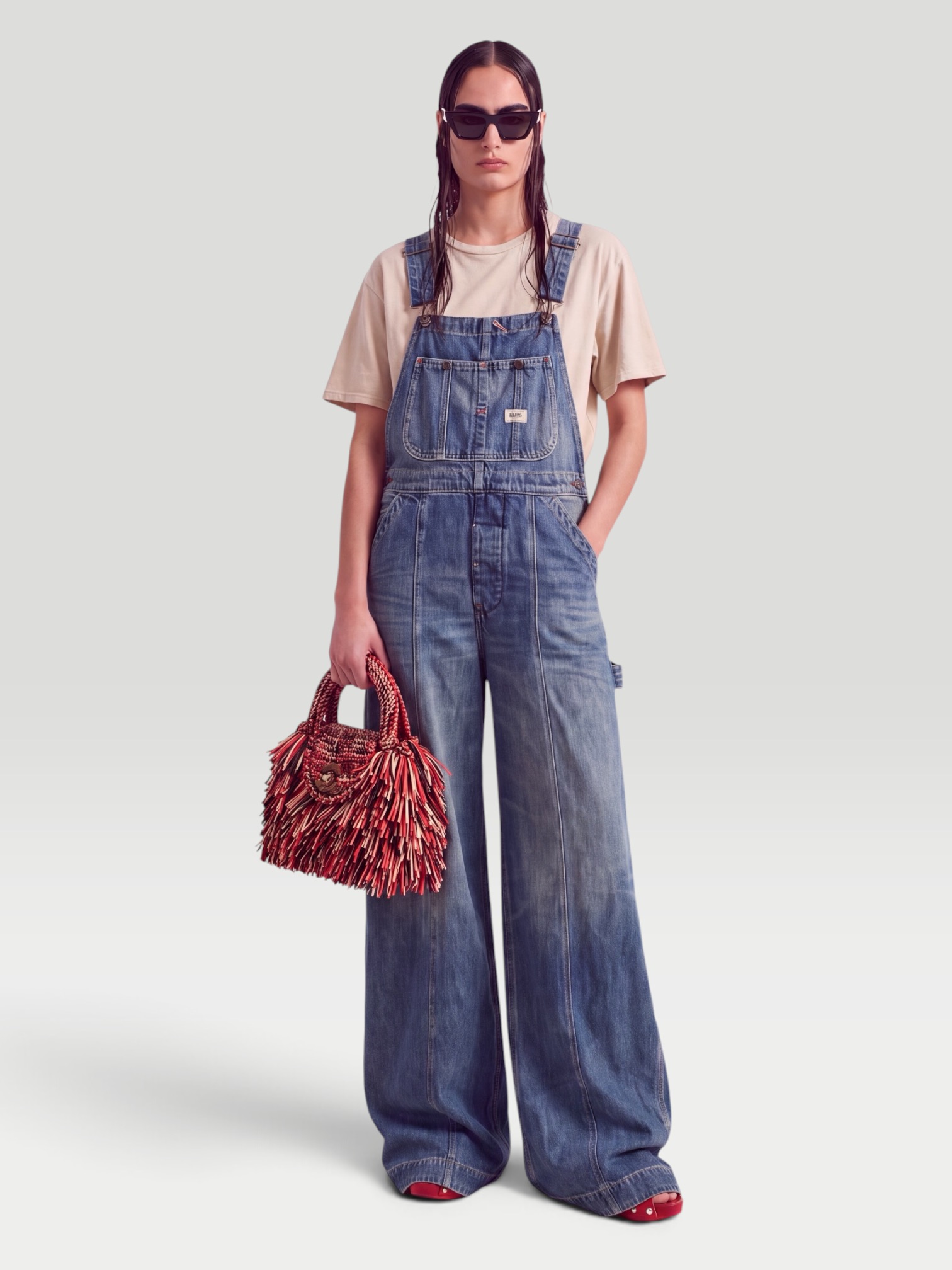 R13 Siouxsie Overall in bedford indigo, worn with Christen Edge Lizard-Effect Leather Flip Flops, Phoebe Philo Small Stud Gig Leather Shoulder Bag, Dries Van Noten Oval Sunglasses, RÙADH The Holt Oversized Organic Cotton-Jersey T-Shirt, walking the city. Styled by Sharon Lombardo for FDV Concierge.