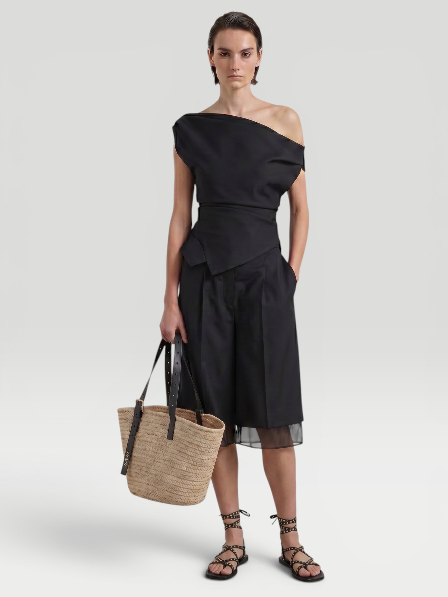 Róhe Off Shoulder Lapel Top in off white, worn with Toteme Lyocell-Blend Tapered Pants, Bottega Veneta Salsa Thong, Phoebe Philo Gig Leather Shoulder Bag, Phoebe Philo Bombe Sunglasses, the evening. Styled by Sharon Lombardo for FDV Concierge.