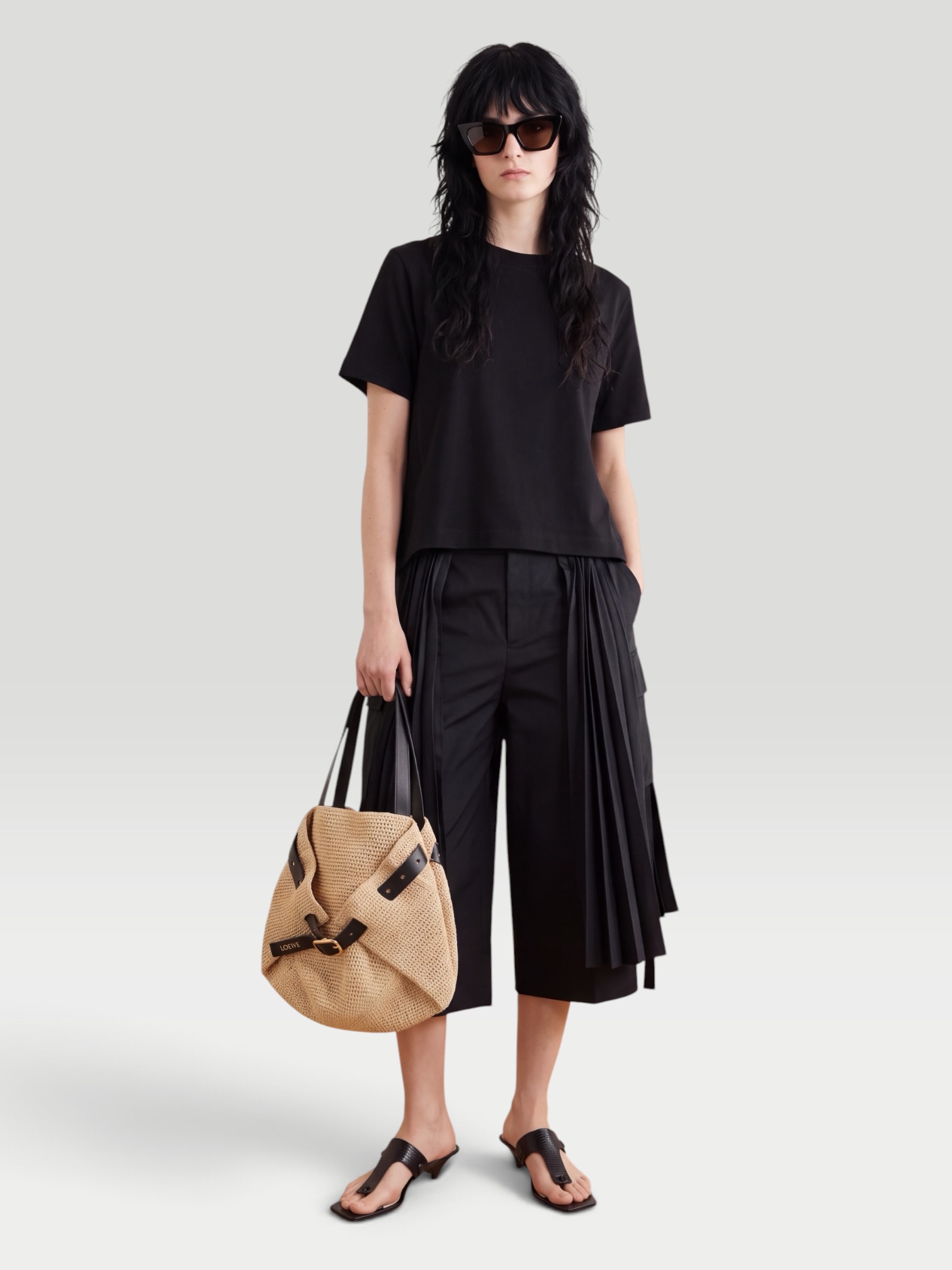 Sacai Pleated Twill Wide-Leg Shorts in black. Styled by Sharon Lombardo for FDV Concierge.