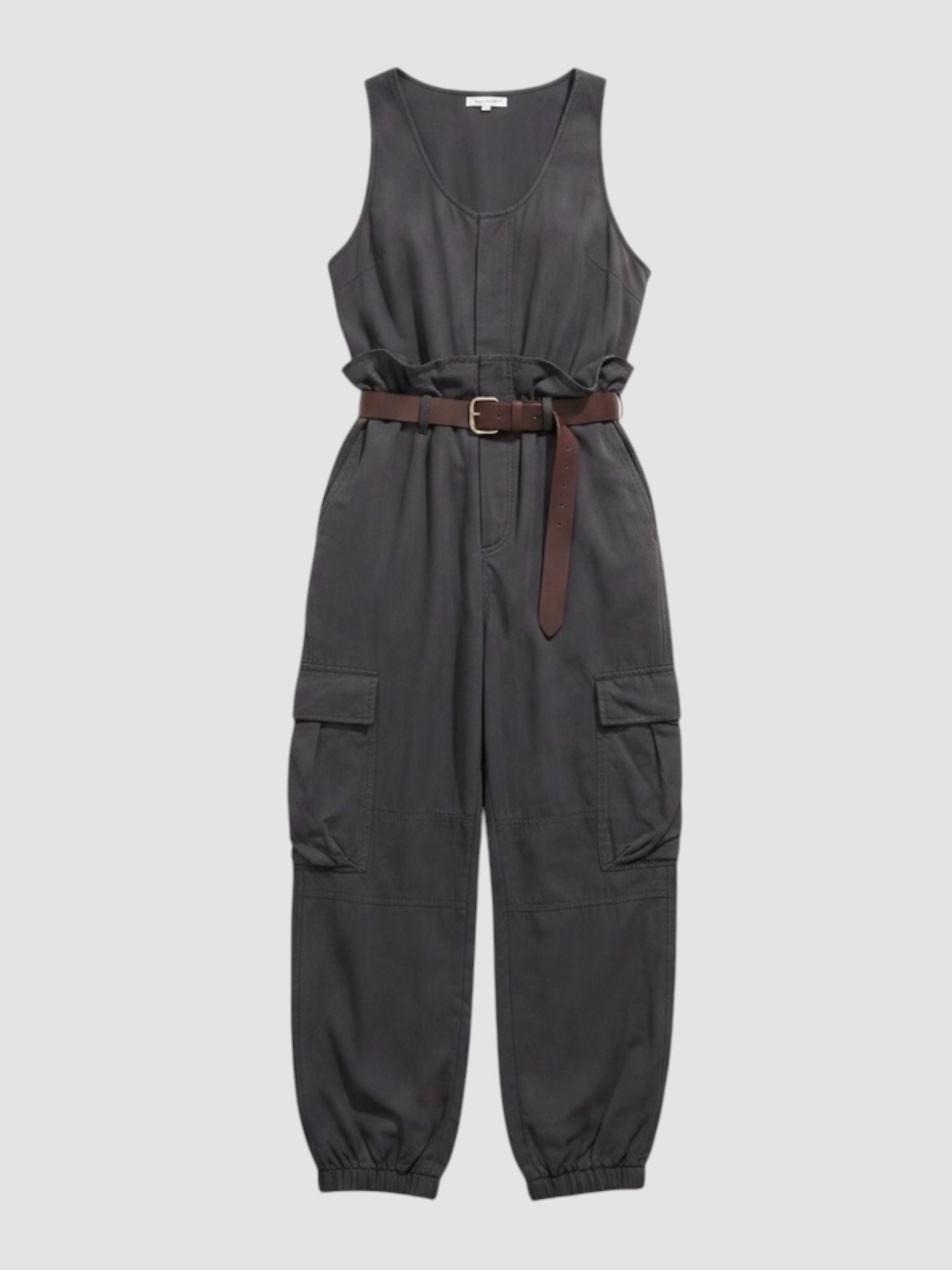 Saint Laurent Cargo Jumpsuit in charcoal, worn with Phoebe Philo Leather Belt, Alaïa Spiral Small Hoop Earrings, CO Ankle Wrap Sandal. Styled by Sharon Lombardo for FDV Concierge.