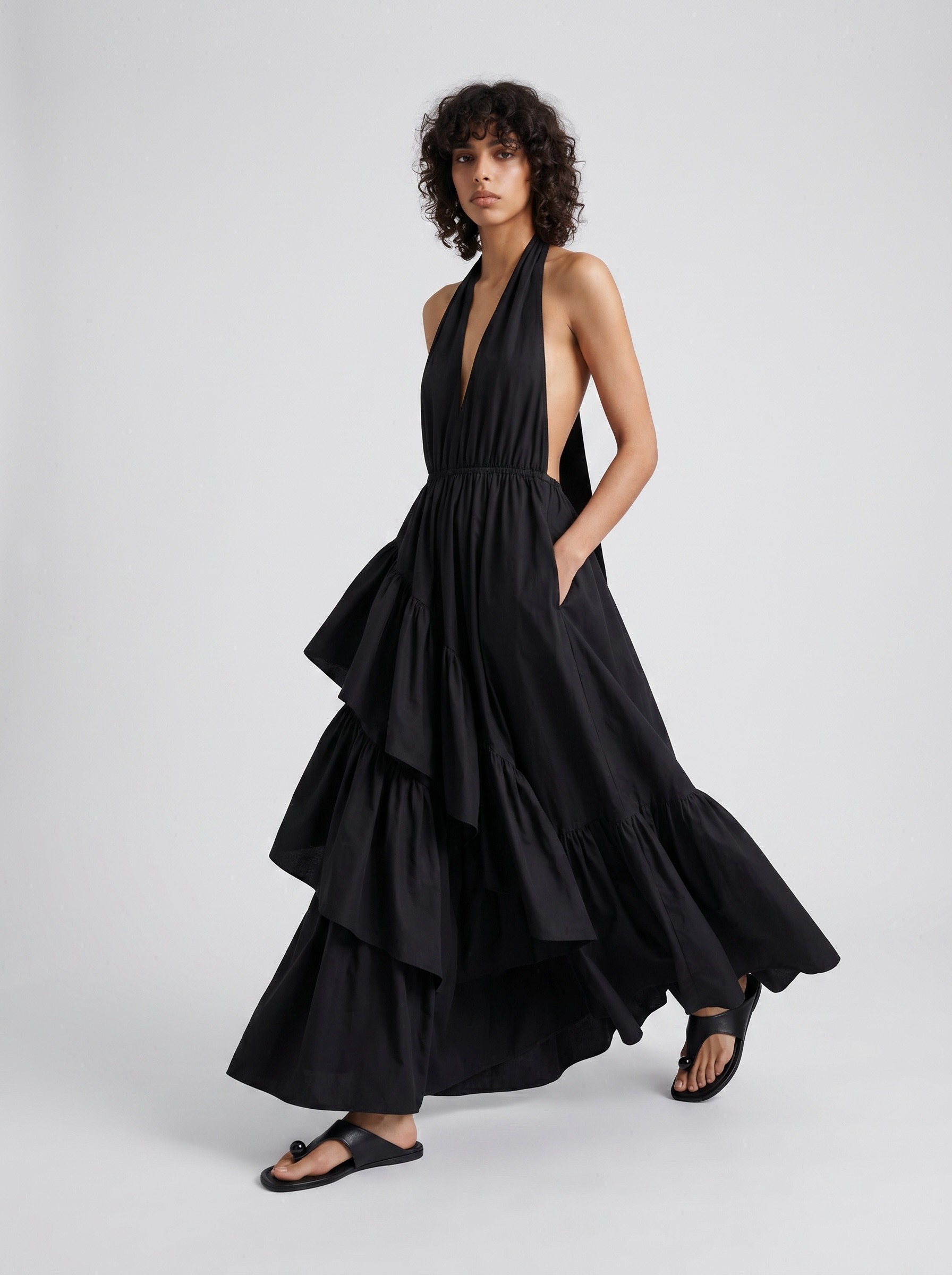 Scanlan Theodore Parachute Cotton Halter Dress in black, worn with Loewe Toggle Flat Sandal. Styled by Sharon Lombardo for FDV Concierge.