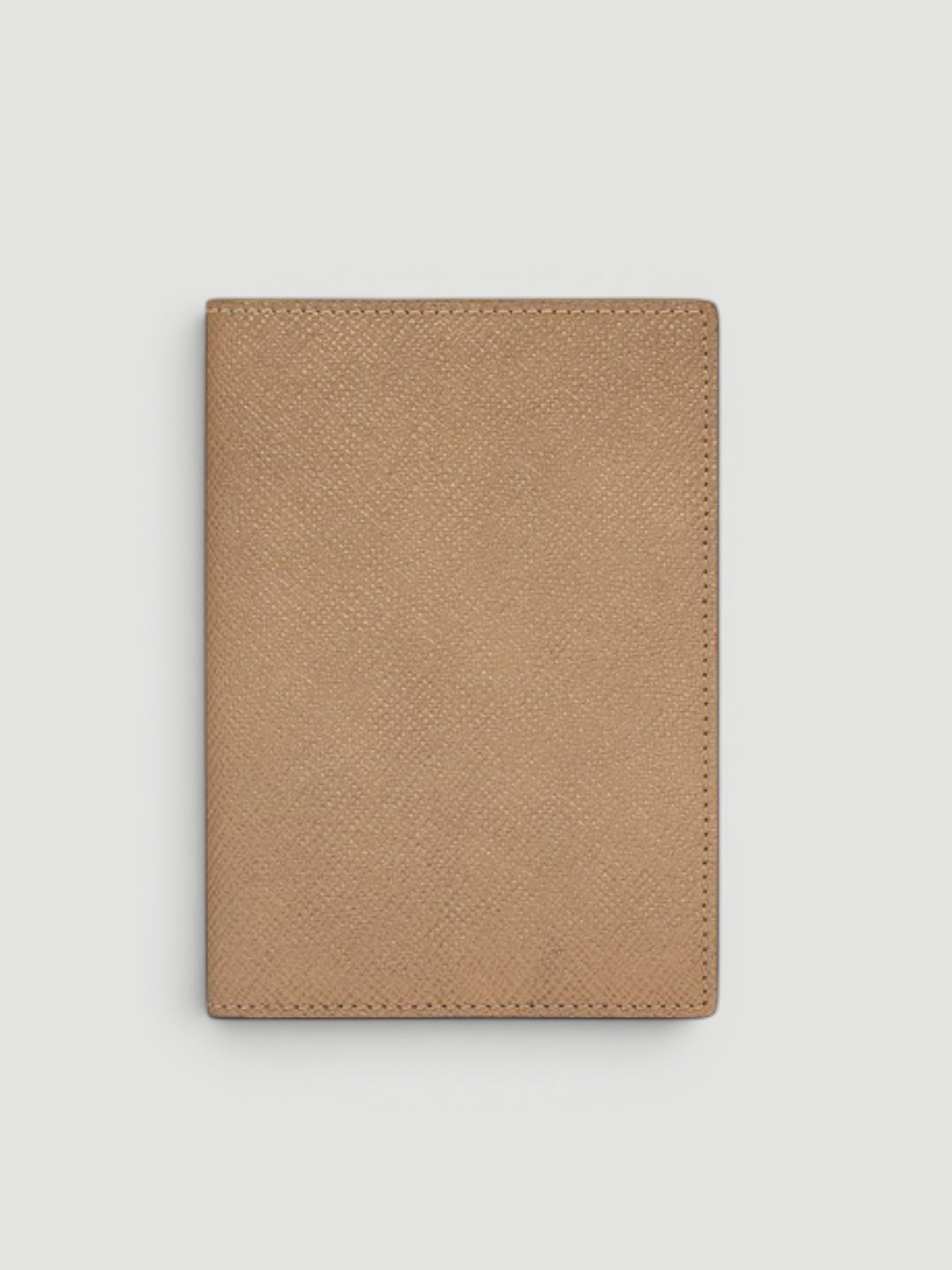 Smythson Panama Leather Passport Cover in bronze.