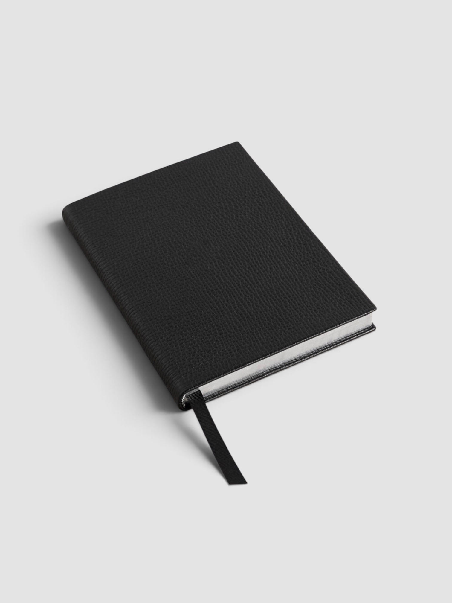 Smythson Soho Ludlow Textured-Leather Notebook in black.