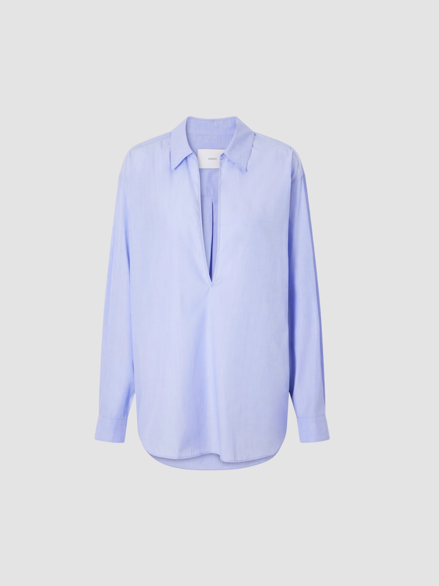 SSSTEIN Skipper Cotton Shirt in blue, worn with Dries Van Noten Printed Cotton-Blend Wide-Leg Pants, Bottega Veneta Salsa Flat Thong, Phoebe Philo Small Stud Cabas Tote Bag, Bottega Veneta Cat-Eye Acetate Sunglasses, the day. Styled by Sharon Lombardo for FDV Concierge.