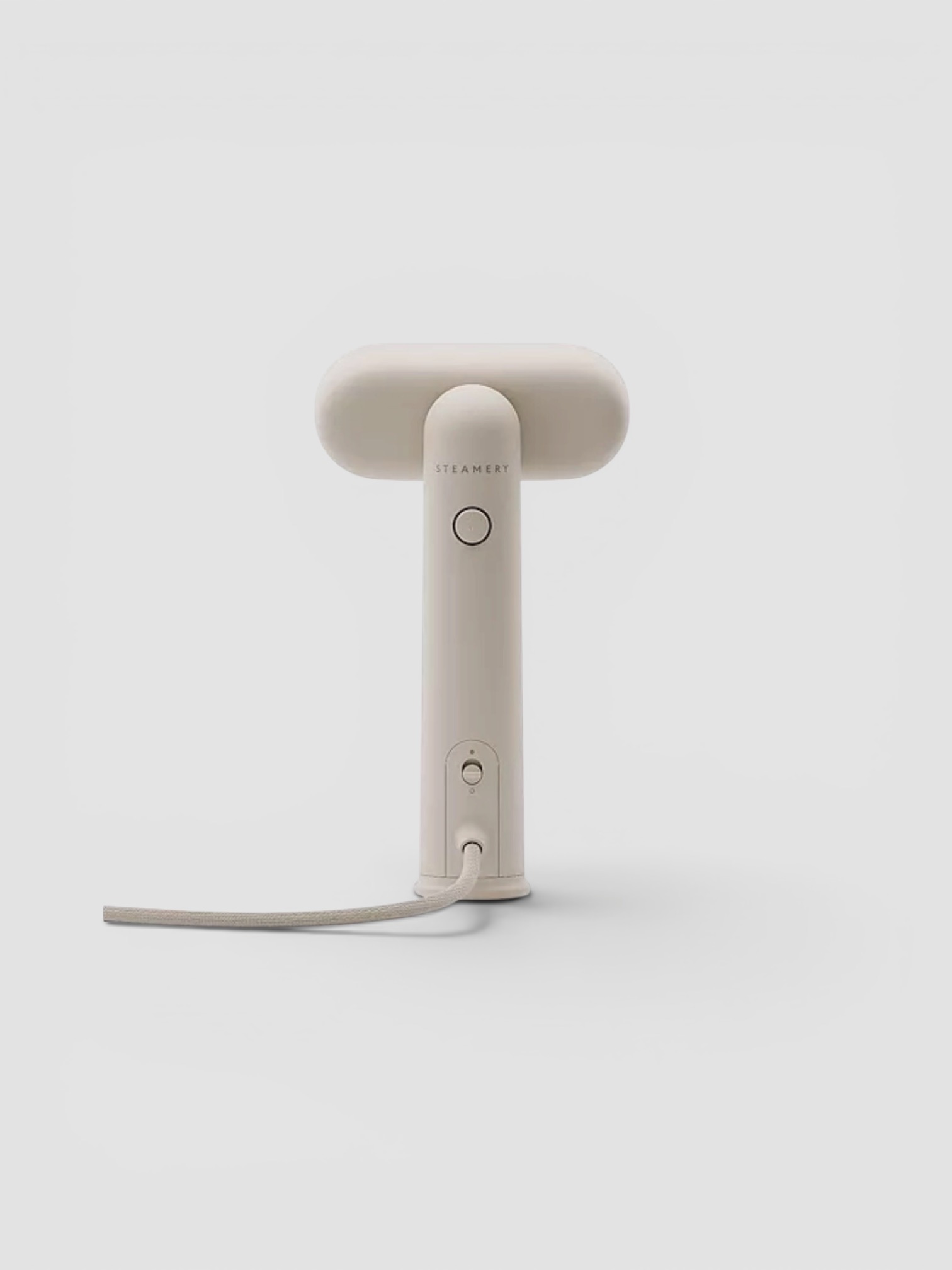 Steamery Cirrus Lite Travel Steamer in sand.