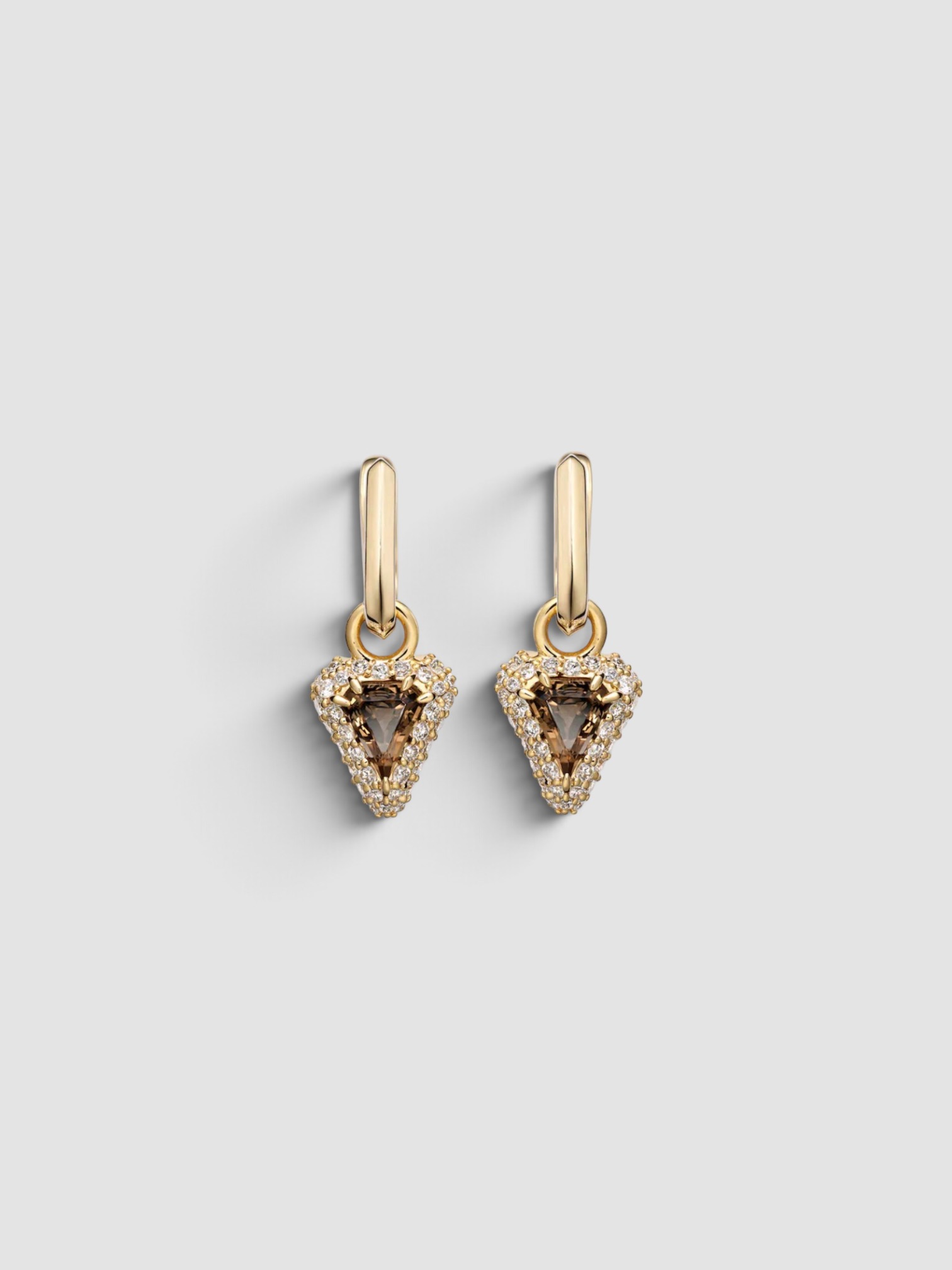 Stone and Strand Power Huggie Earrings in gold.