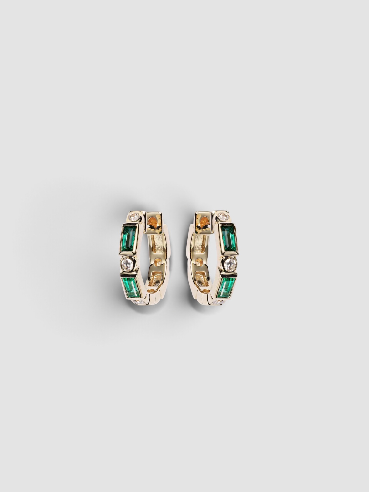 Sydney Evan Huggie Earrings with Diamonds and Emeralds in gold.