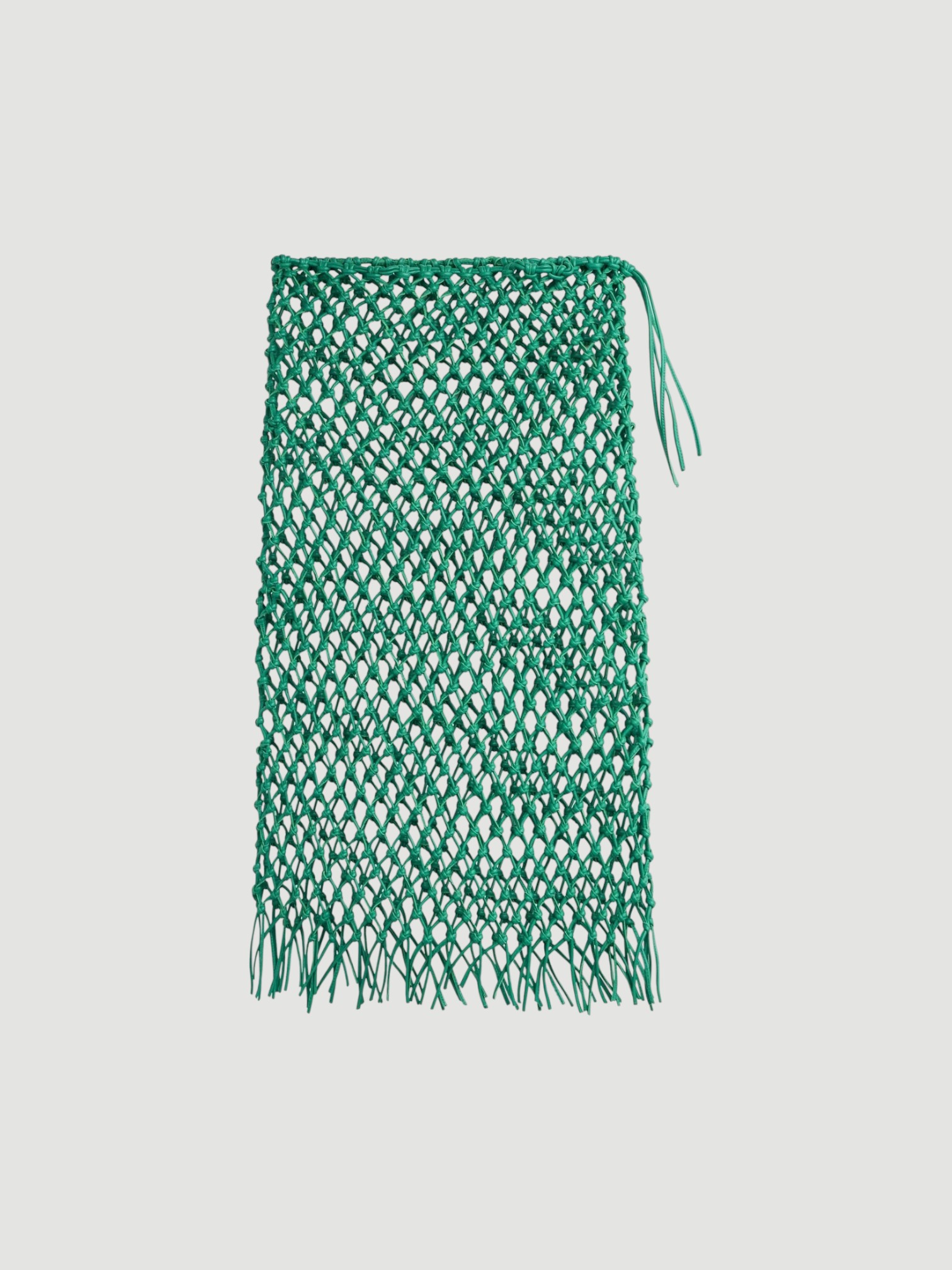 The Frankie Shop Nelaya Leather Macrame Skirt in emerald. Styled by Sharon Lombardo for FDV Concierge.
