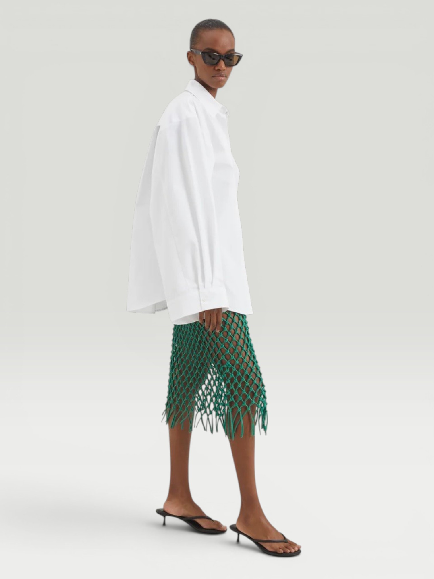 The Frankie Shop Nelaya Leather Macrame Skirt in emerald. Styled by Sharon Lombardo for FDV Concierge.