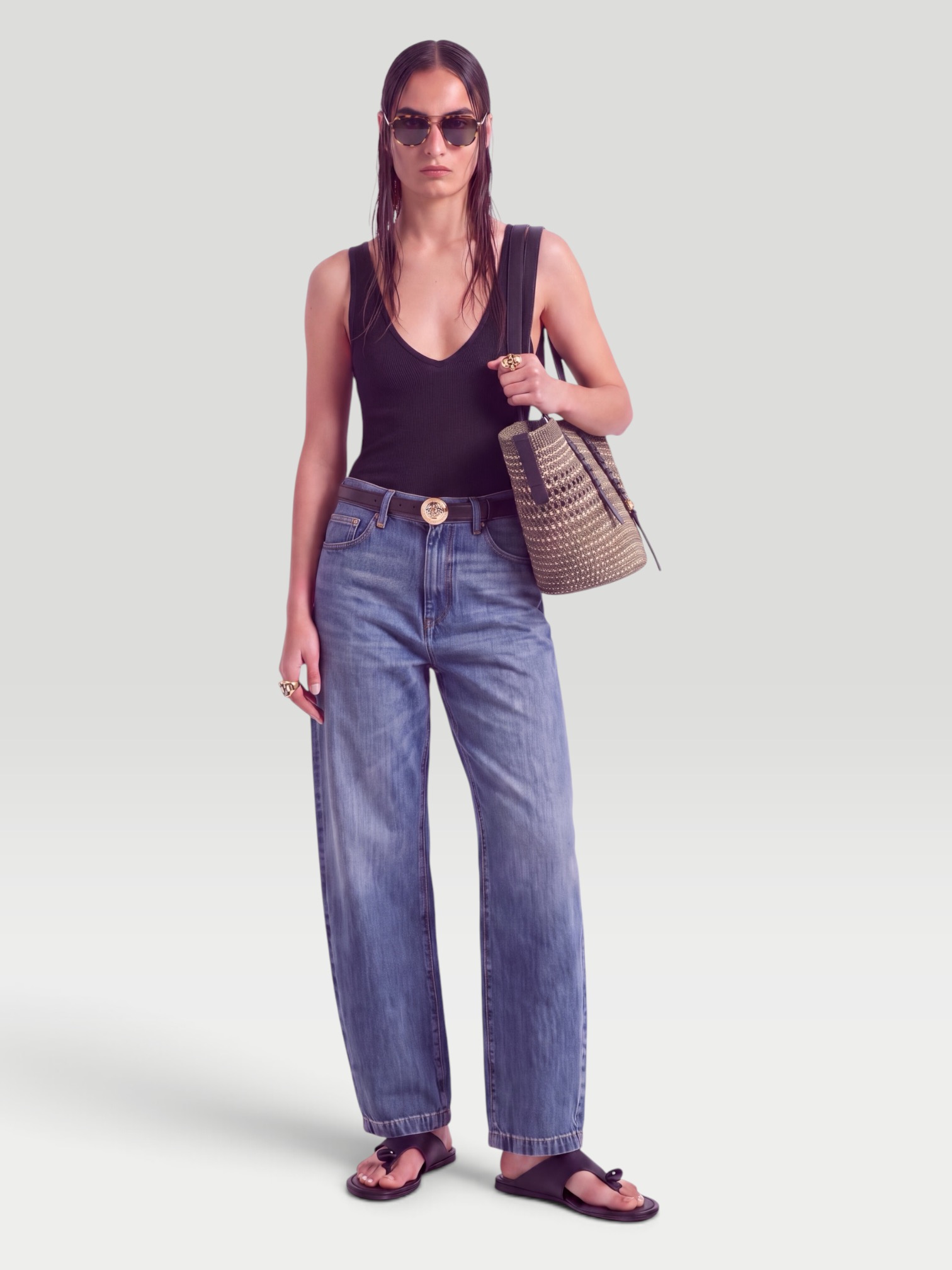 The Attico Mid-Rise Barrel-Leg Jeans in blue. Styled by Sharon Lombardo for FDV Concierge.