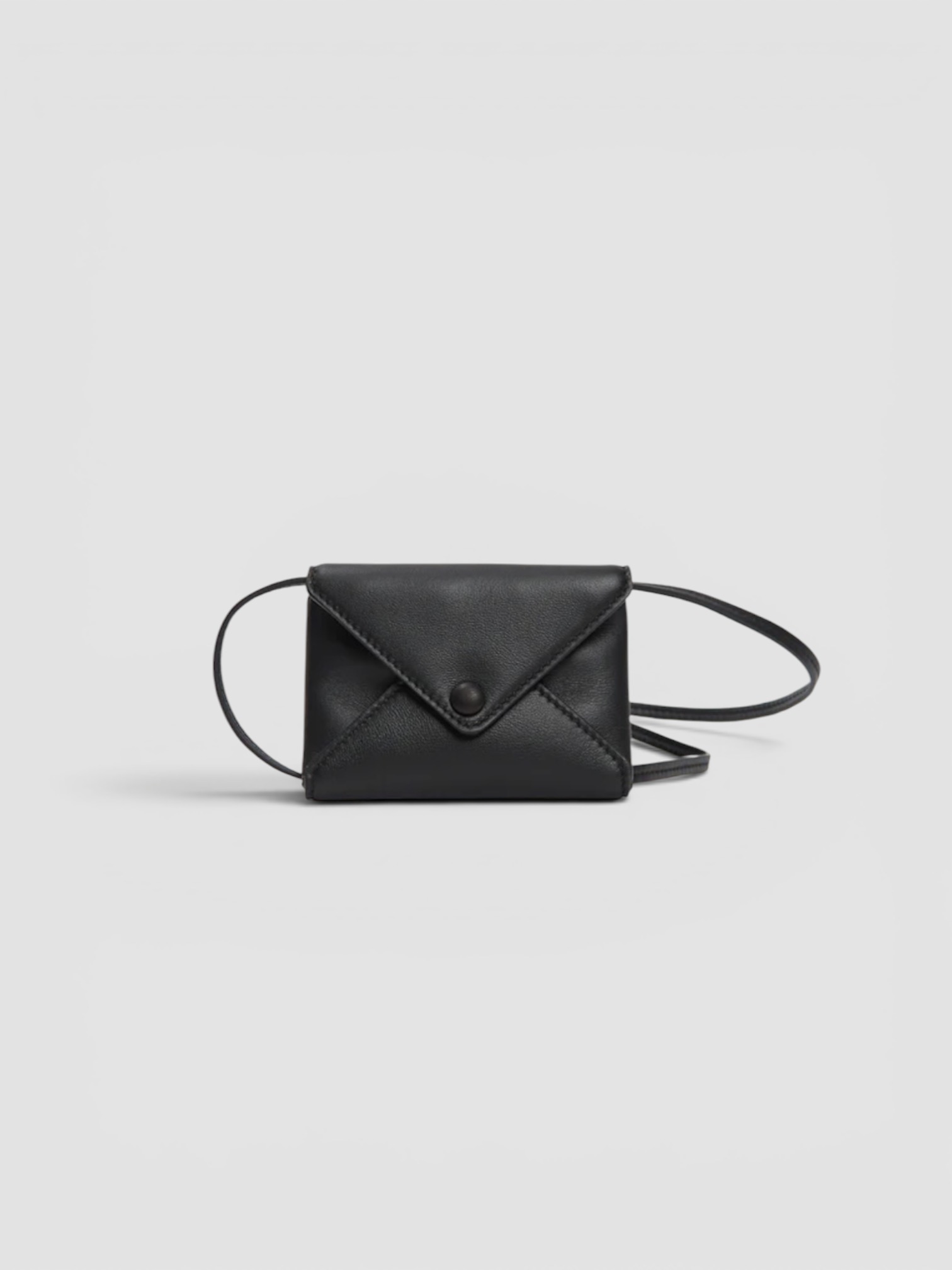 The Row Mini Leather Envelope in black, worn with FIL DE VIE Isadora Dress. Styled by Sharon Lombardo for FDV Concierge.