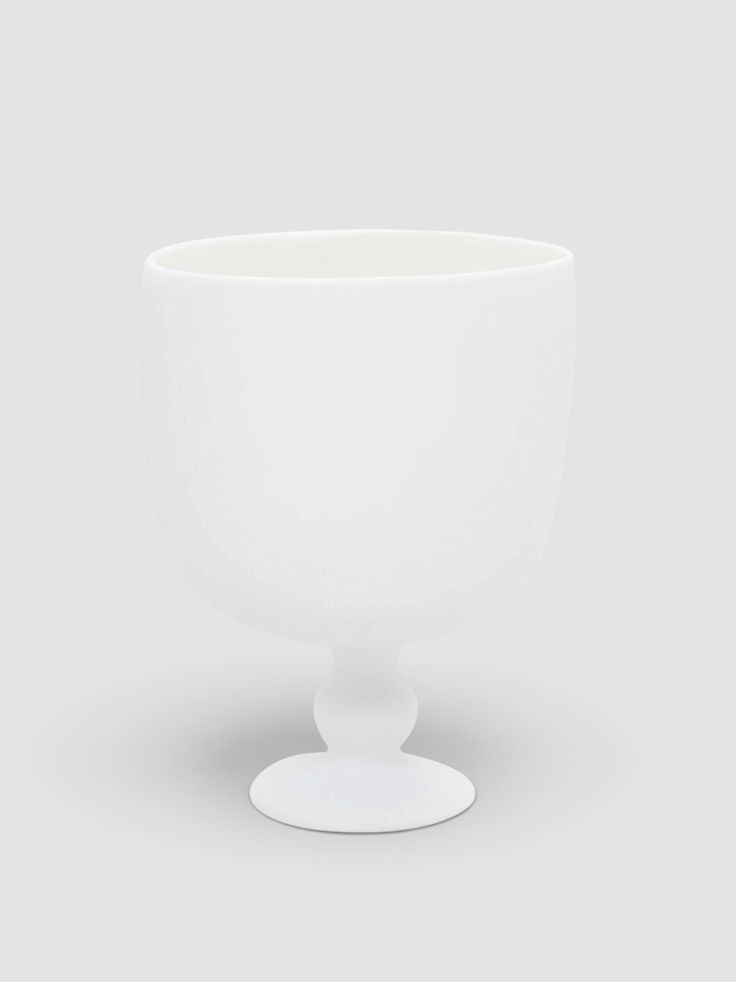 Tina Frey Designs Pedestal Resin Champagne Bucket in white.