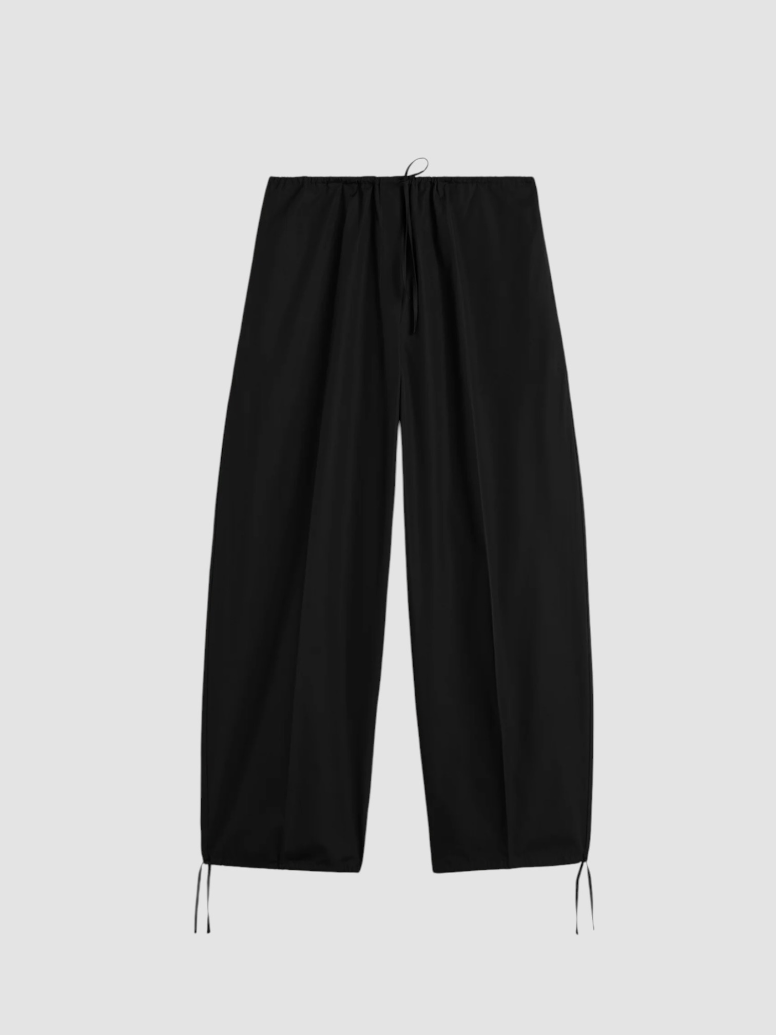 Totême Drawstring Cotton Trousers in black. Styled by Sharon Lombardo for FDV Concierge.