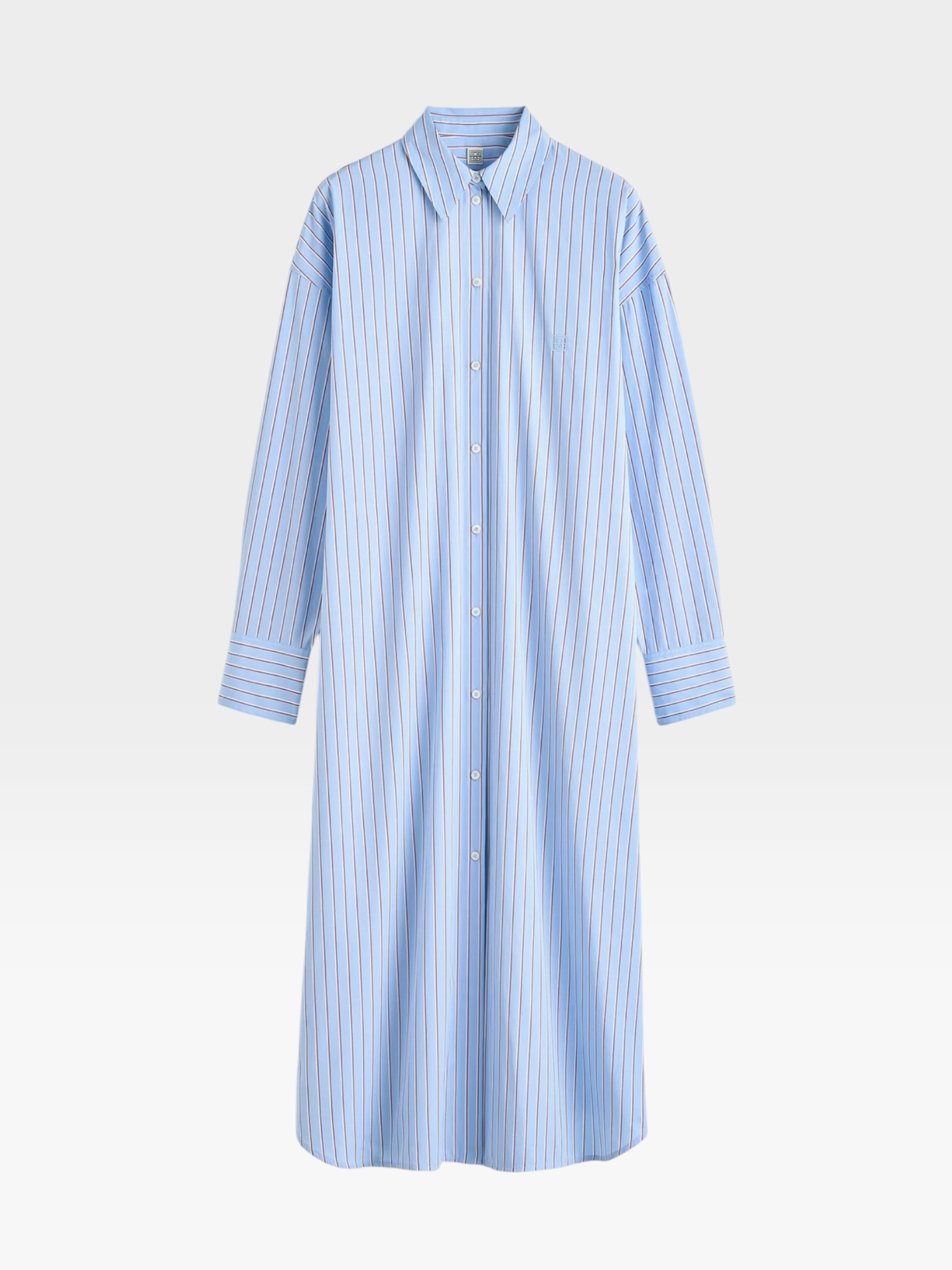 Totême Striped Shirtdress in pale blue / red, worn with Loewe Leather-Trimmed Raffia Tote. Styled by Sharon Lombardo for FDV Concierge.