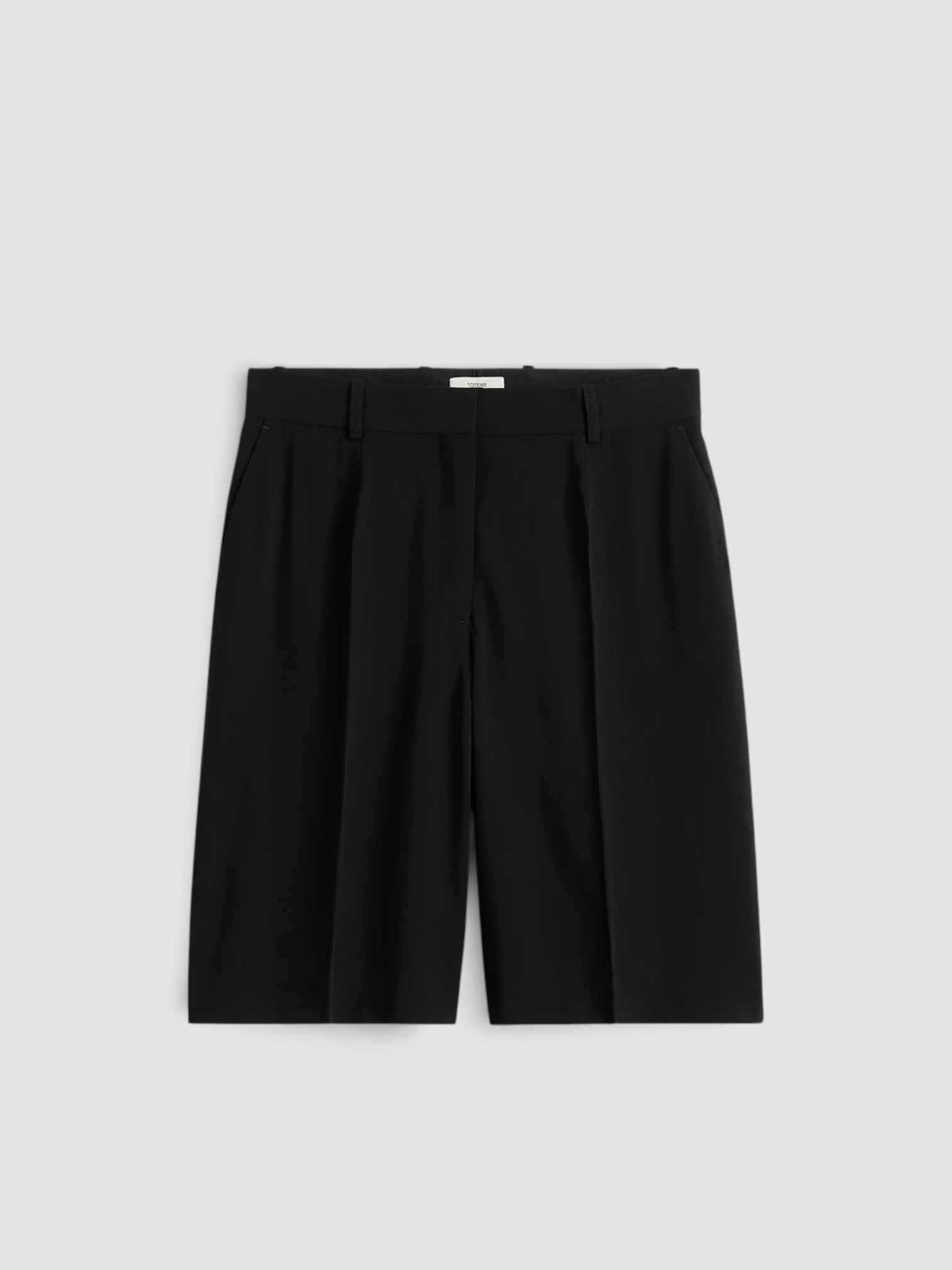 Totême Wide Fluid Shorts in black. Styled by Sharon Lombardo for FDV Concierge.