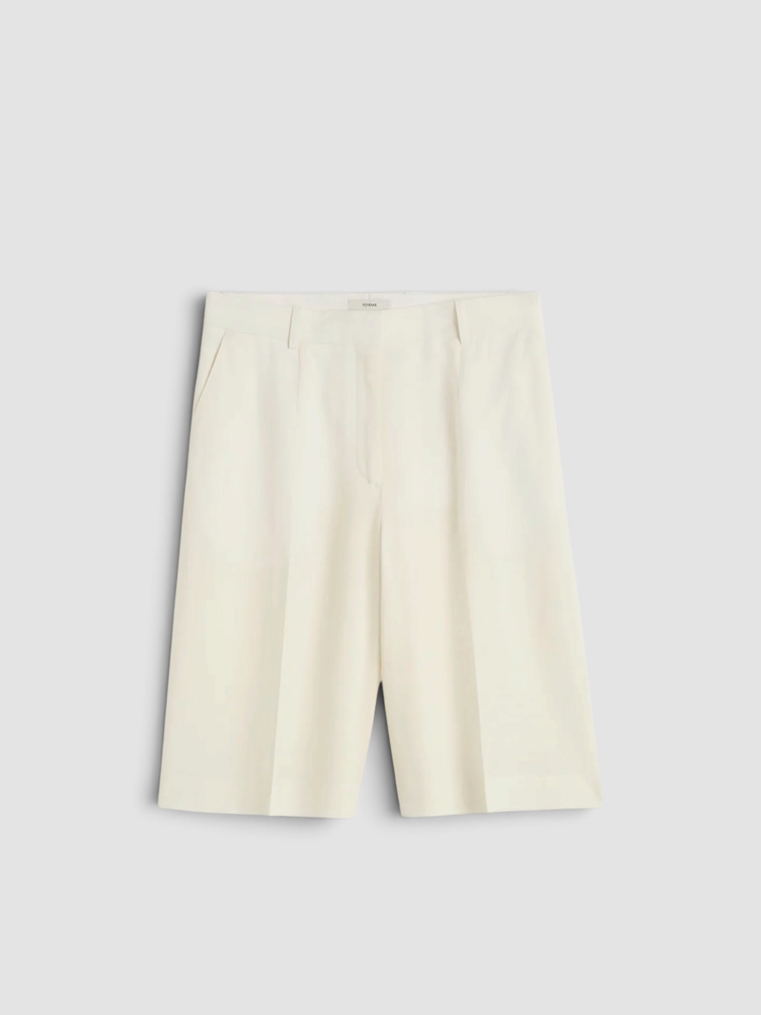 Totême Wide Fluid Shorts in ecru. Styled by Sharon Lombardo for FDV Concierge.