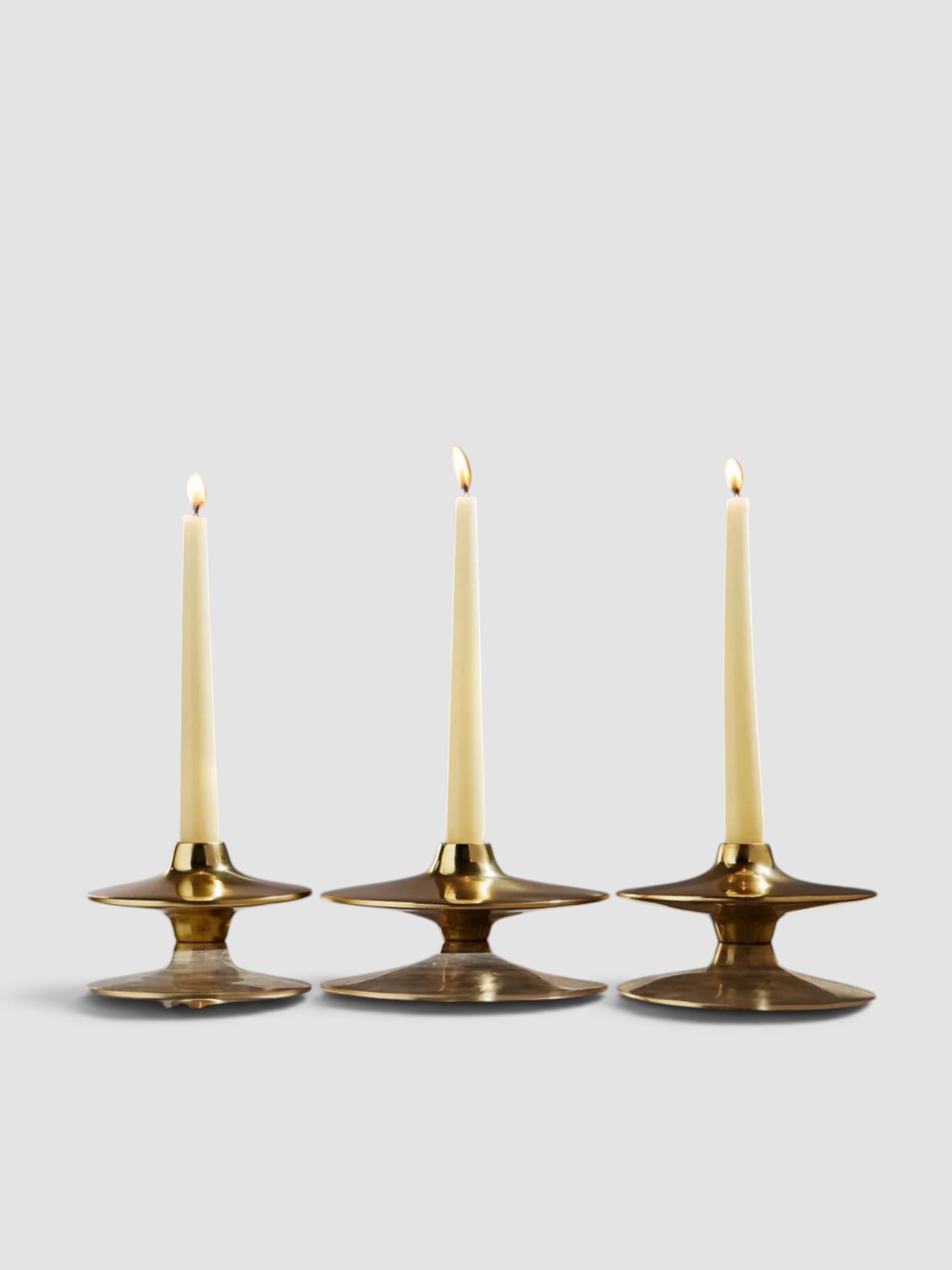 Viya Spin Brass Candlesticks, Set of 3 in metallics.