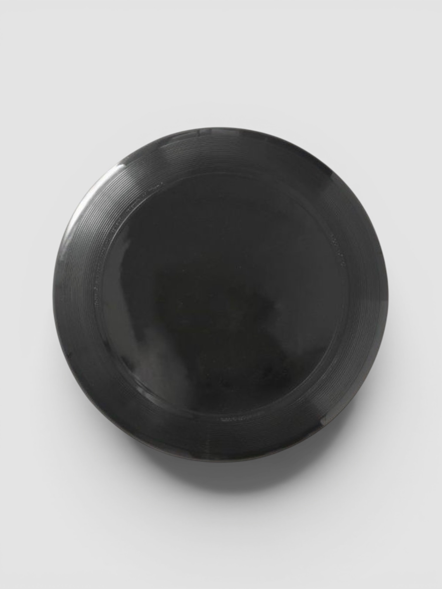 Wham-O Ultimate Frisbee in black.