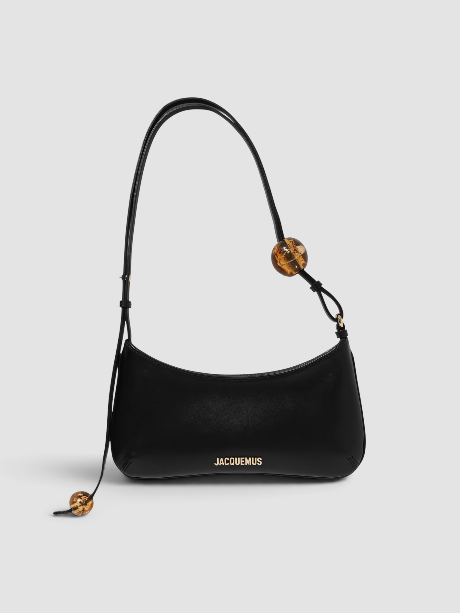 Jacquemus The Bisou Perle Embellished Leather Shoulder Bag in black, worn with FIL DE VIE Isadora Dress. Styled by Sharon Lombardo for FDV Concierge.