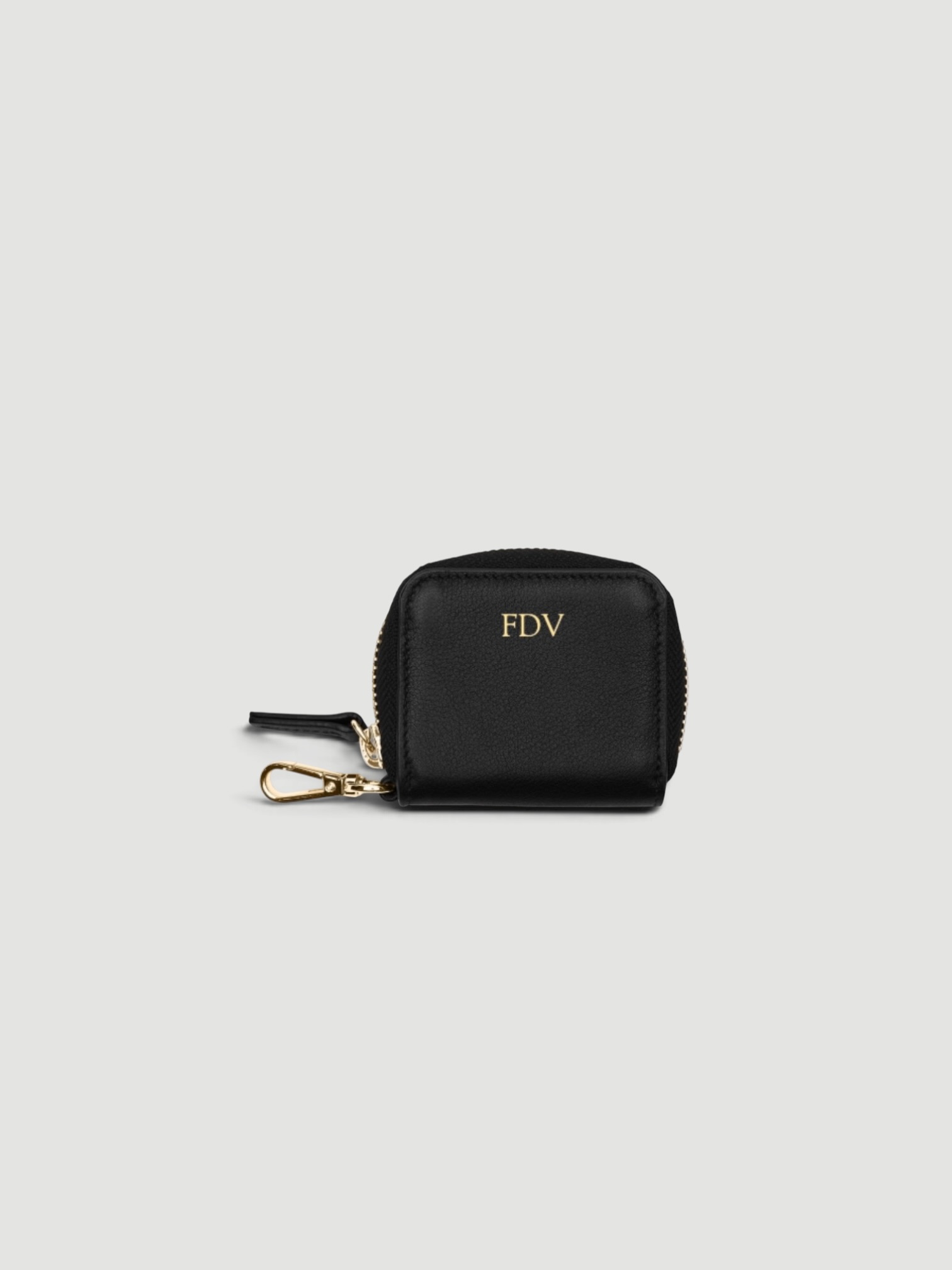 Leatherology Portable Wristlet AirPod Case in black.