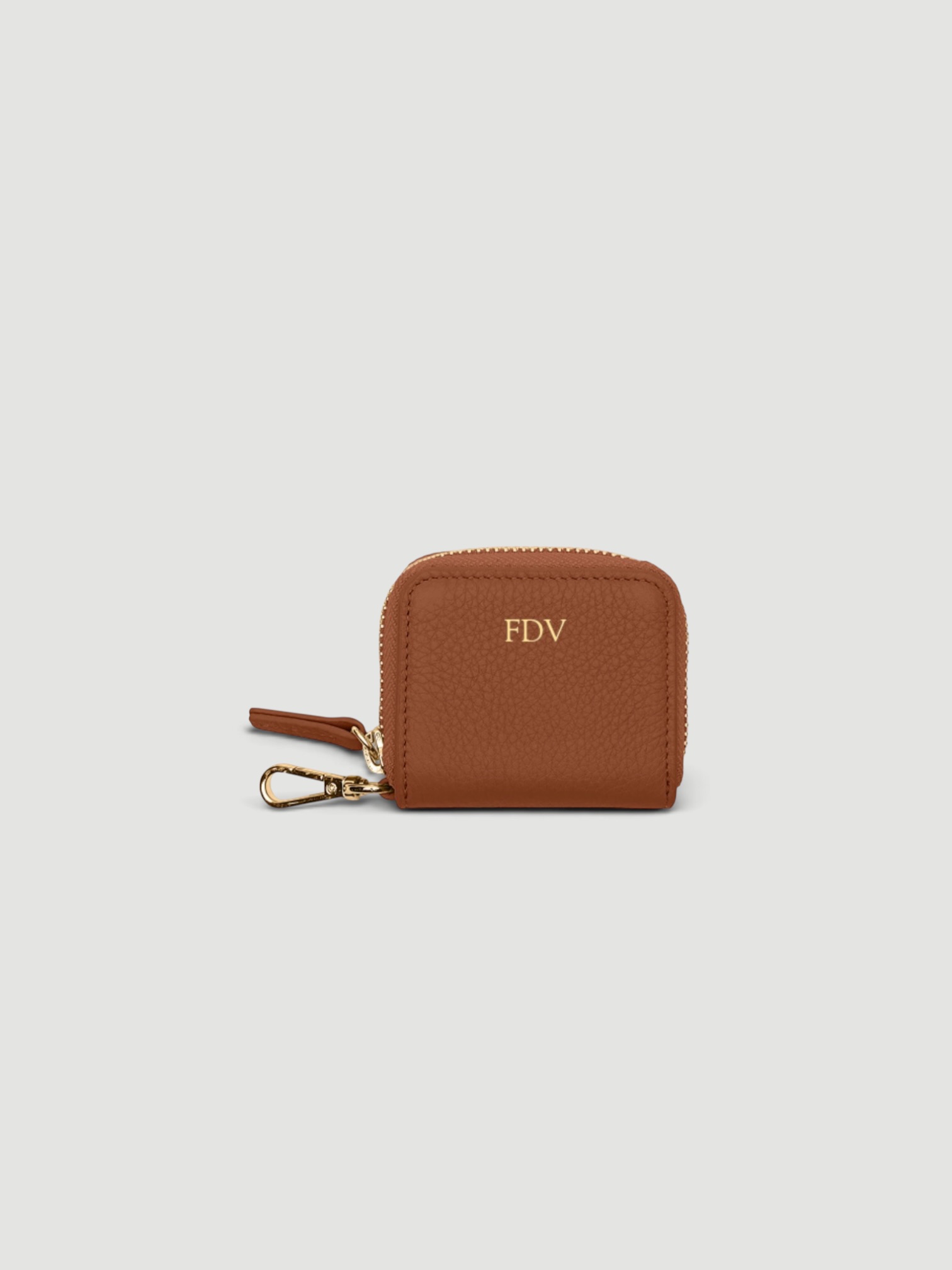 Leatherology Portable Wristlet AirPod Case in saddle.