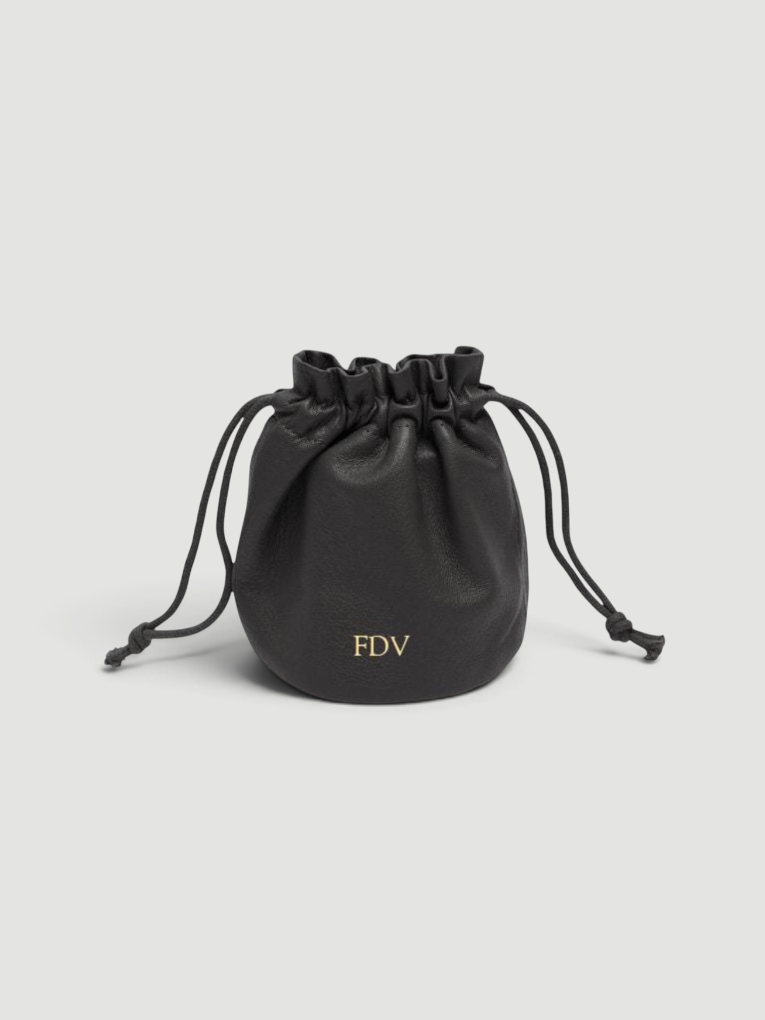 Leatherology Round Drawstring Pouch in black.