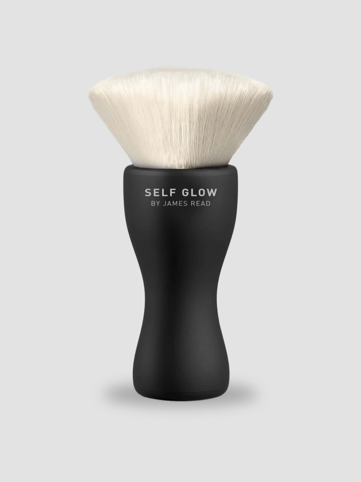 Self Glow by James Read Sunbrush Face & Body Brush in black/white.