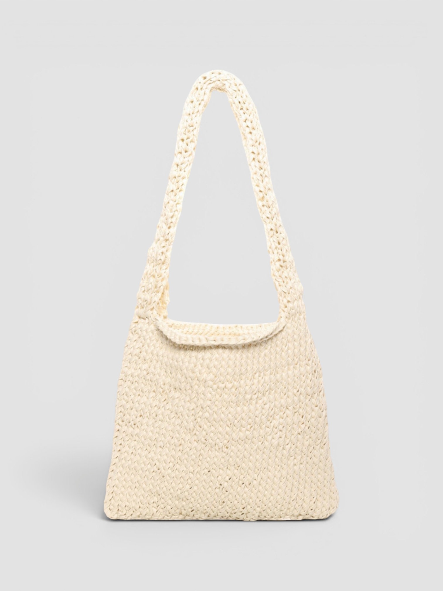 The Row Didion Knit Cotton Shoulder Bag in white, worn with Totême Striped Shirtdress. Styled by Sharon Lombardo for FDV Concierge.