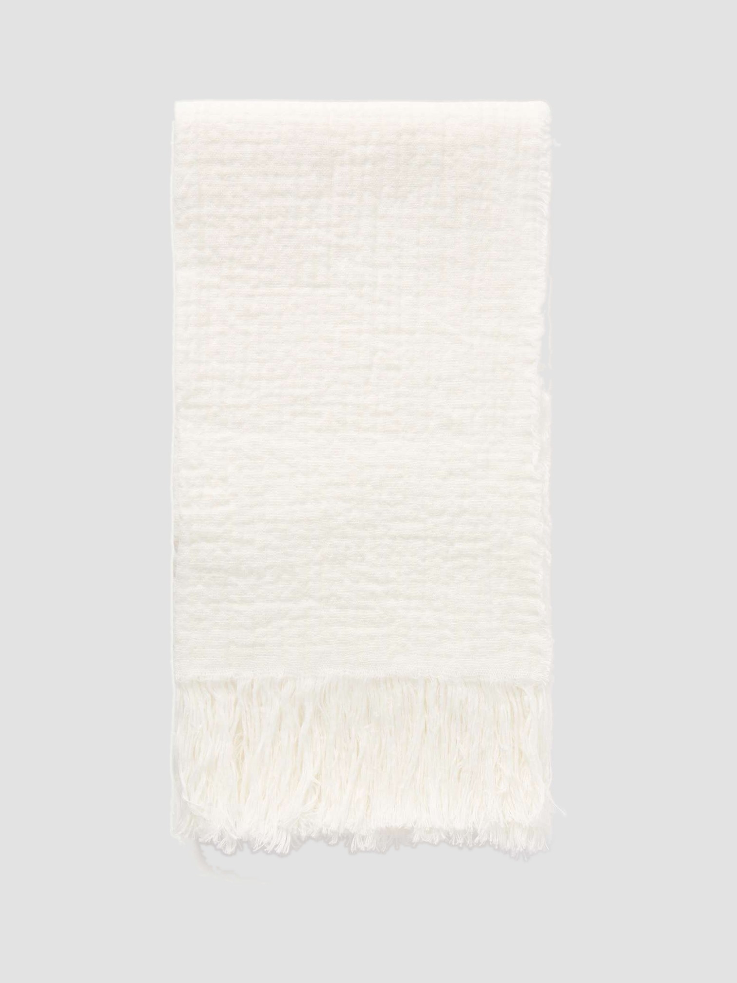 The Row Kastel Fringed Crinkled-Linen Scarf in white.